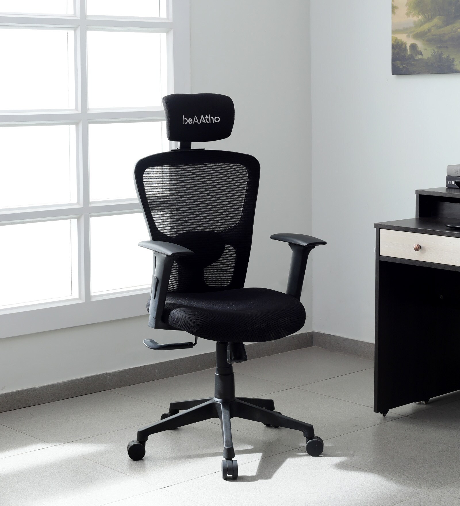 Oslo Breathable Mesh Ergonomic Chair in Black colour with Headrest Oslo Breathable Mesh Ergonomic Chair in Black colour with Headrest