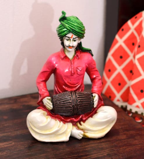 Pink Polyresin Rajasthani Lady Playing Dholak Figurine