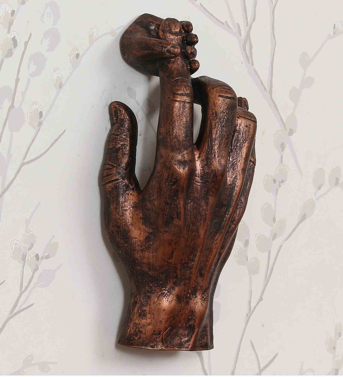 Buy Polyresin Holding Hand Wall Art In Brown By eCraftIndia Online
