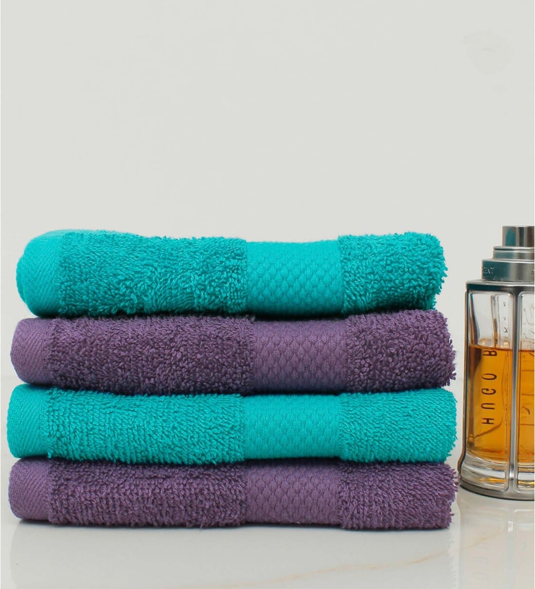 Buy Multicolor Solid 500 GSM 100 Cotton Hand Towels (Set of 4) by AVI
