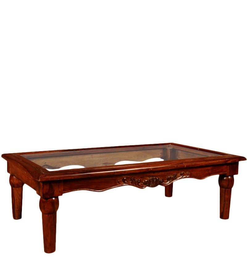 carved wood table with glass top