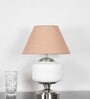 Ramzi Chrome Finish Metal And Frosted White Glass Table Lamp With Beige Cotton Shade