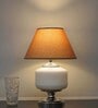 Ramzi Chrome Finish Metal And Frosted White Glass Table Lamp With Beige Cotton Shade