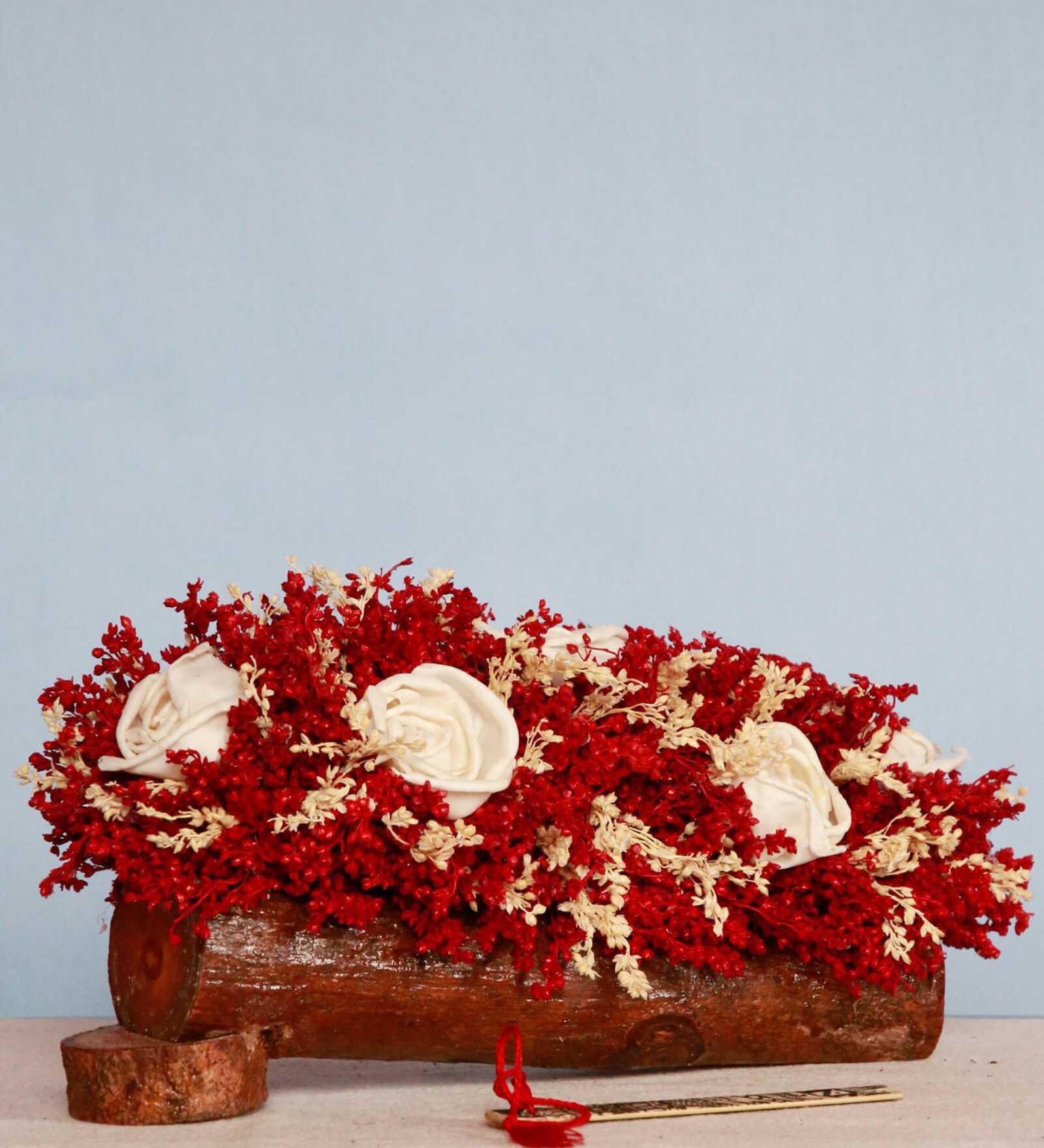 Red Sola Natural Dried Flowers On Wooden Bark