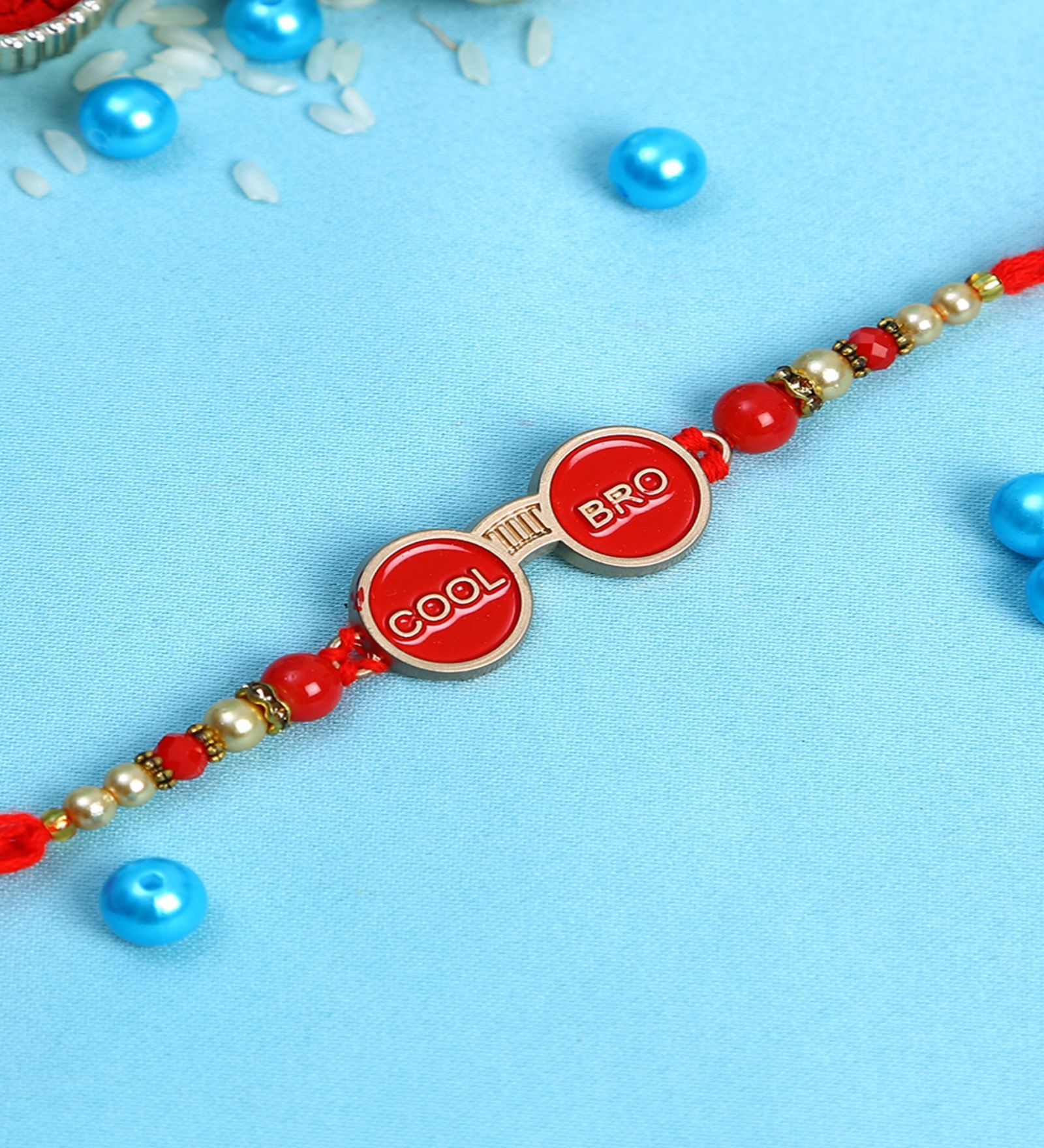 Red Thread & Plastic Rakhi Set