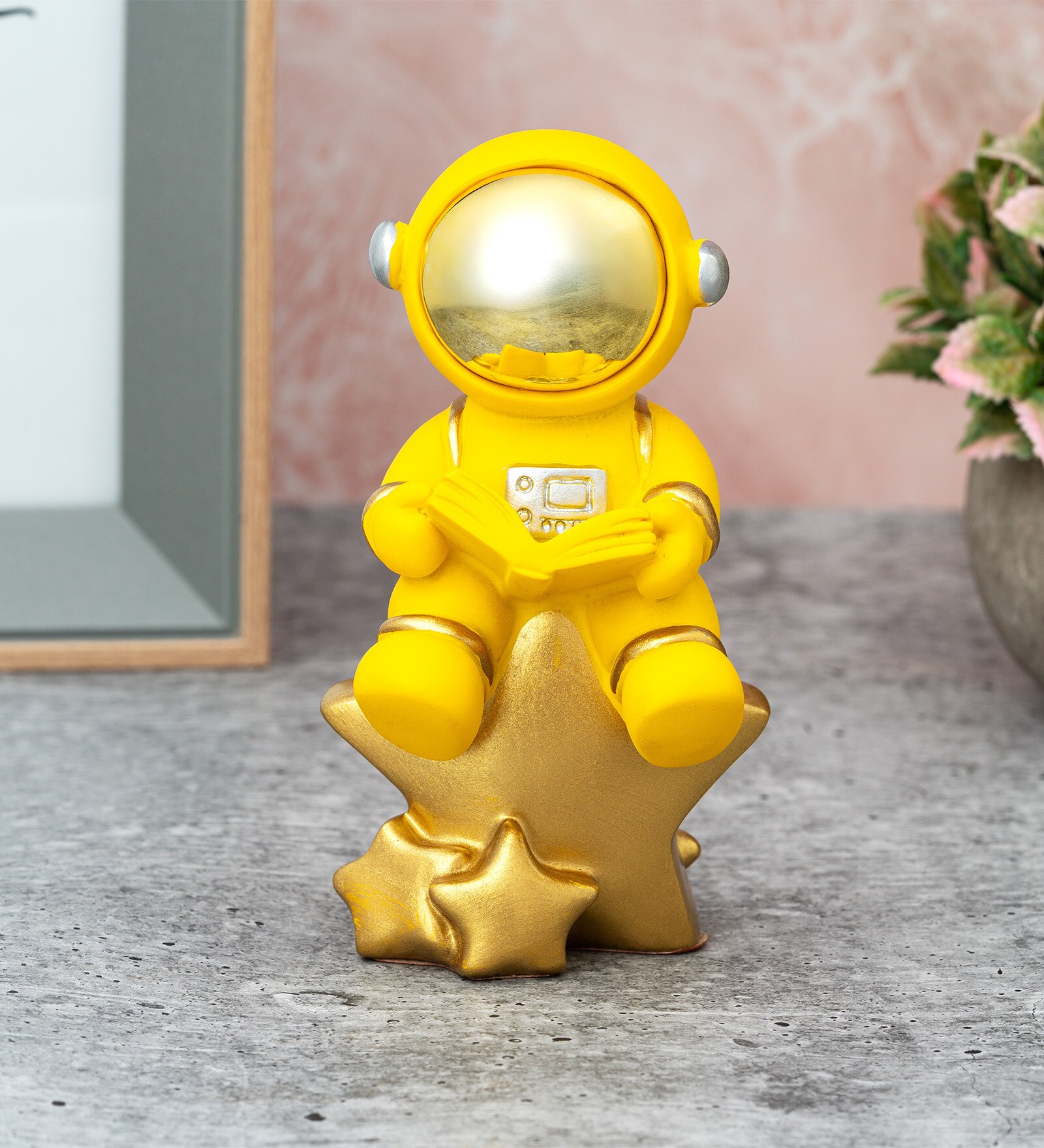 Yellow Resin Astronaut On Star Showpiece