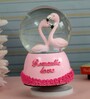 Romantic Love Couple Pink Rotating Snow Globe with Music Polyresin & Glass Showpiece