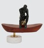 Thinking Man On Boat Sculpture  Wood , Aluminium & Stone  Gold Plated Metal