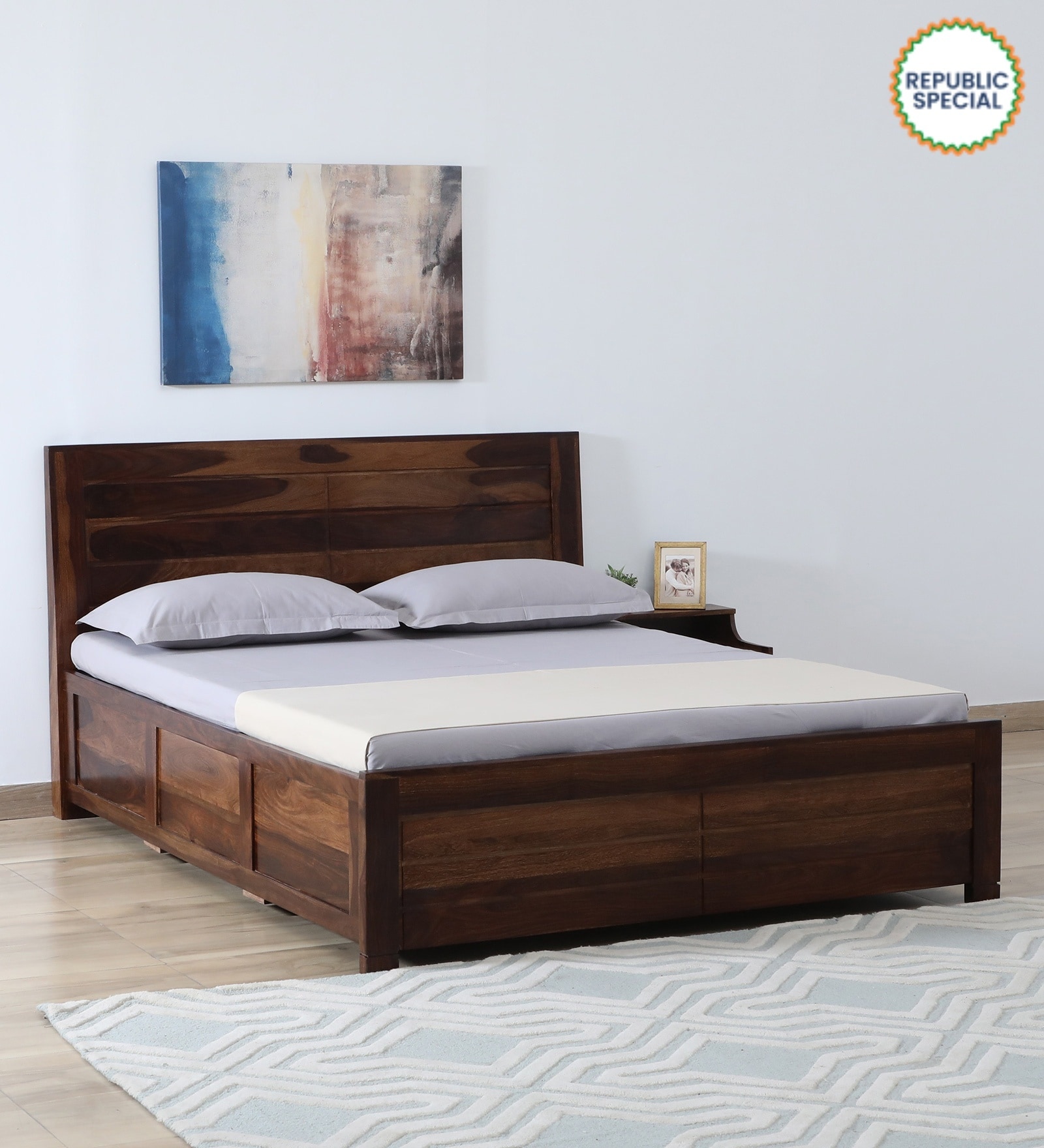 Segur Sheesham Wood King Size Bed In Provincial Teak Finish With Hydraulic Storage