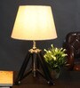Small Black Tripod Table Lamp With Tapered Beige Lampshade