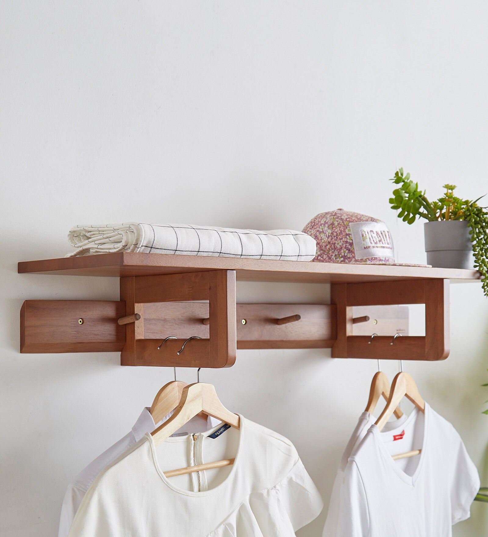 Solid Wood Fancy Clothes Hanger Wall Shelf in Brown Colour