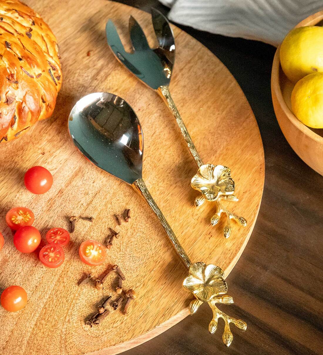 https://ii1.pepperfry.com/media/catalog/product/s/t/1100x1210/stainless-steel-and-brass-gold-and-nickel-cicek-salad-serving-spoon-and-fork-by-logam-stainless-stee-ntkrjt.jpg