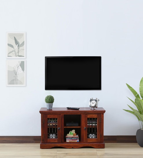 https://ii1.pepperfry.com/media/catalog/product/s/t/494x544/stafford-sheesham-wood-in-honey-oak-finish-for-tvs-up-to-32--by-amberville-stafford-sheesham-wood-in-4nsnxu.jpg