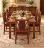 Tarang 6 Seater Dining Set In Provincial Teak Finish With Plum Colour Chair Tarang 6 Seater Dining Set In Provincial Teak Finish With Plum Colour Chair