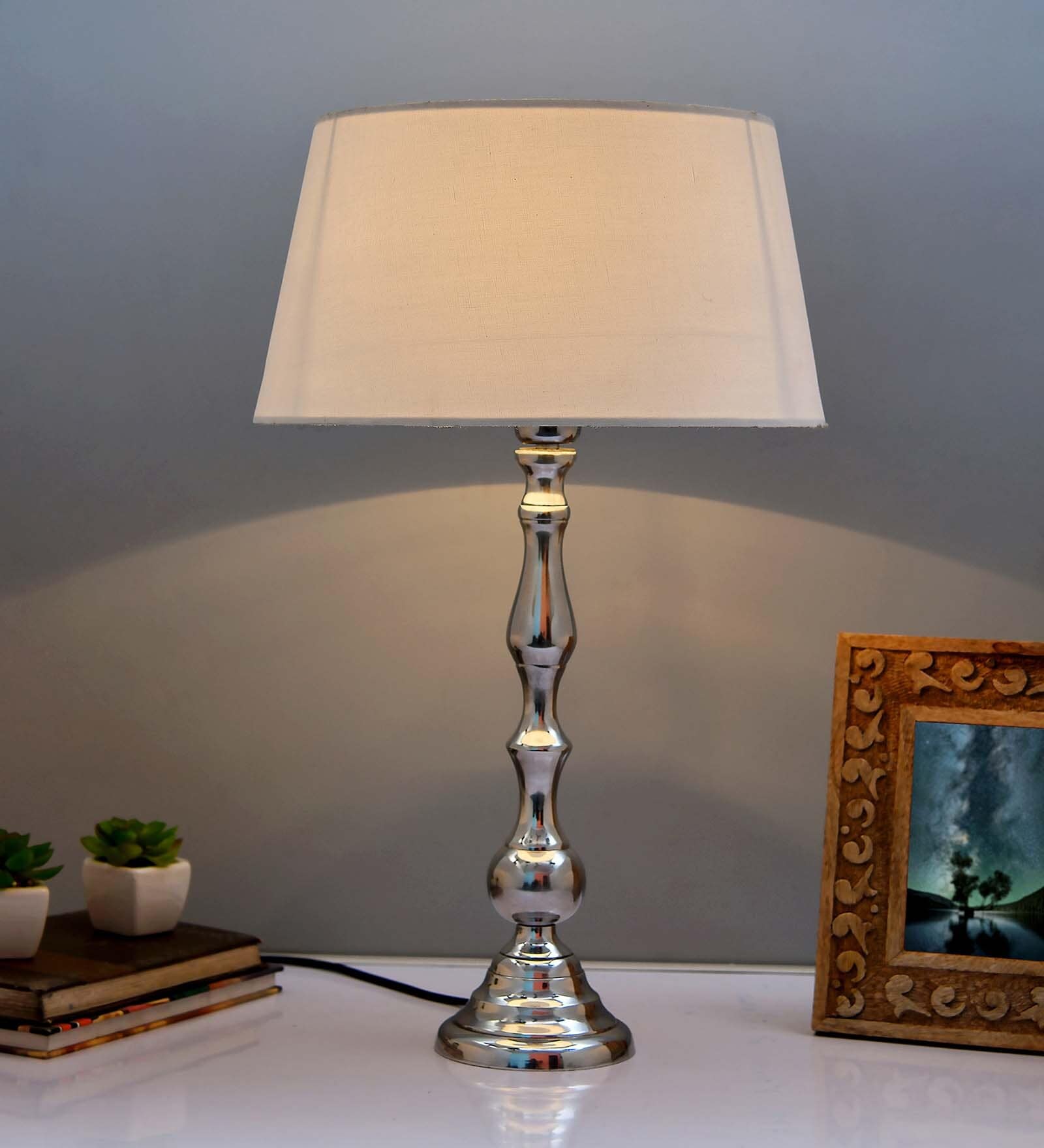 Teardrop chrome lamp with white drum shade