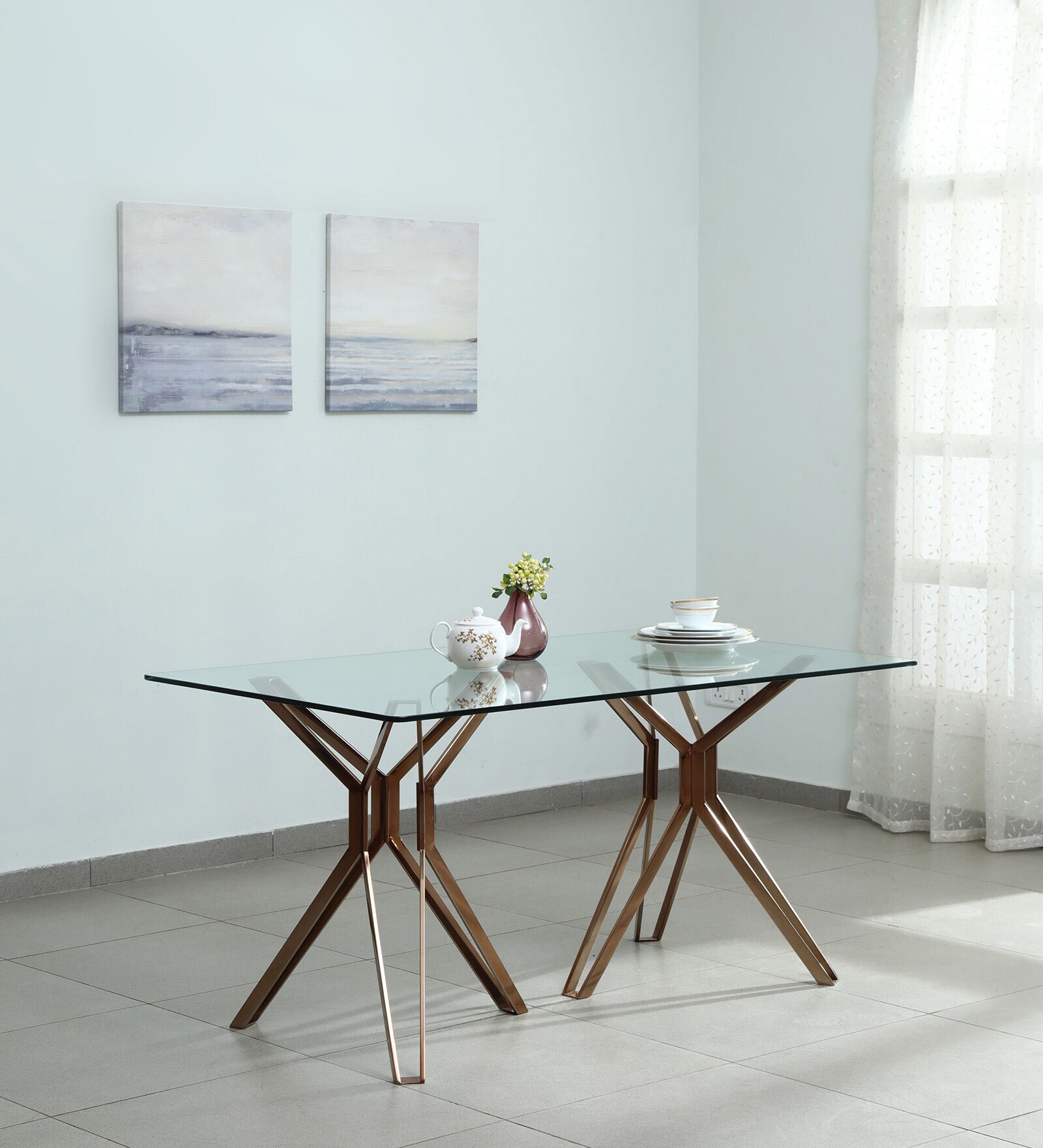 Tripod Glass 6 Seater Dining Table In Rose Gold Finish Tripod Glass 6 Seater Dining Table In Rose Gold Finish
