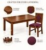 Vajra 6 Seater Dining Set In Provincial Teak Finish With Plum Colour Chair Vajra 6 Seater Dining Set In Provincial Teak Finish With Plum Colour Chair