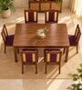 Vedika 6 Seater Dining Set In Provincial Teak Finish With Plum Colour Chair Vedika 6 Seater Dining Set In Provincial Teak Finish With Plum Colour Chair