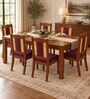 Vedika 6 Seater Dining Set In Provincial Teak Finish With Plum Colour Chair Vedika 6 Seater Dining Set In Provincial Teak Finish With Plum Colour Chair