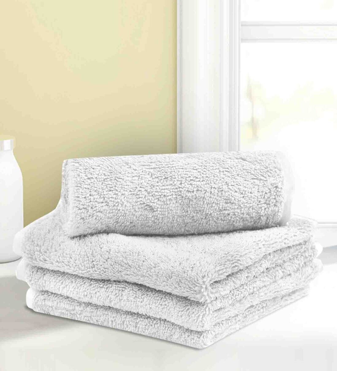 Buy White Solid 500 GSM Cotton Face Towels (Set of 4) by LUSH & BEYOND