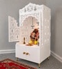 White Wooden Floor Pooja Mandir with Laser-Cut Lotus & Bell Doors Shubh Labh Design Hanging Diya Motifs & Storage Cabinet