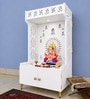 White Wooden Floor Pooja Mandir with Om & Swastik Design Ganesh Laser-Cut Back Panel Bell Motifs & Storage Cabinet
