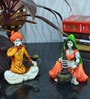 Yellow Combo of Rajasthani Hookah Man and Lady Statue
